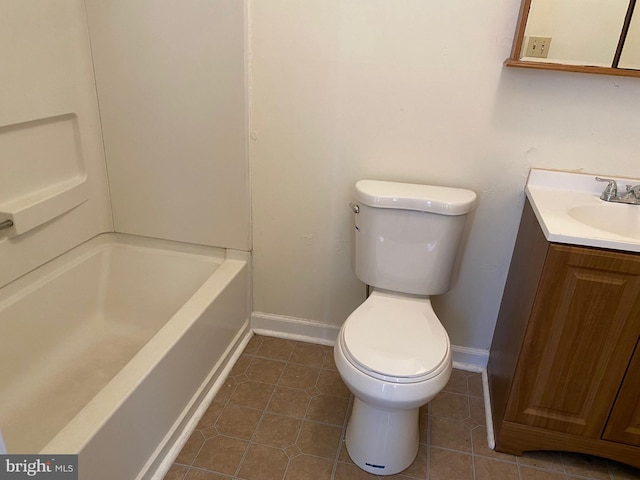 full bathroom featuring baseboards, vanity, toilet, and tile patterned floors