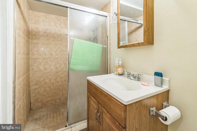 bathroom featuring vanity and a shower stall