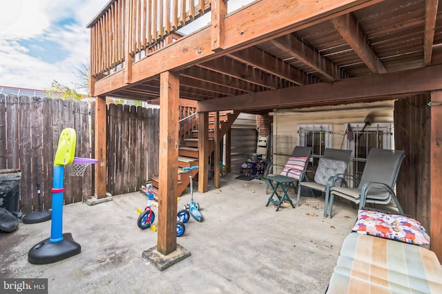 view of patio / terrace with stairs and fence