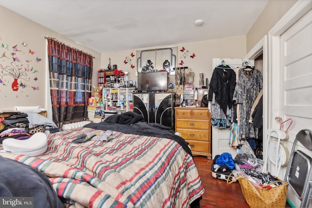 bedroom with wood finished floors