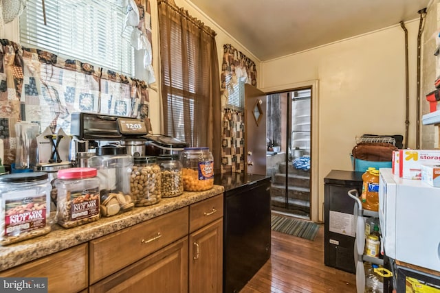 kitchen with dark wood-style floors and brown cabinets