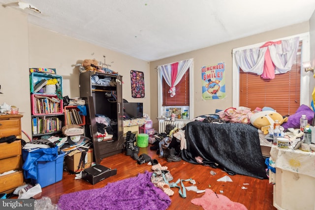 bedroom with wood finished floors