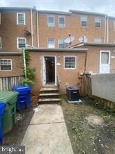 back of house featuring entry steps and cooling unit