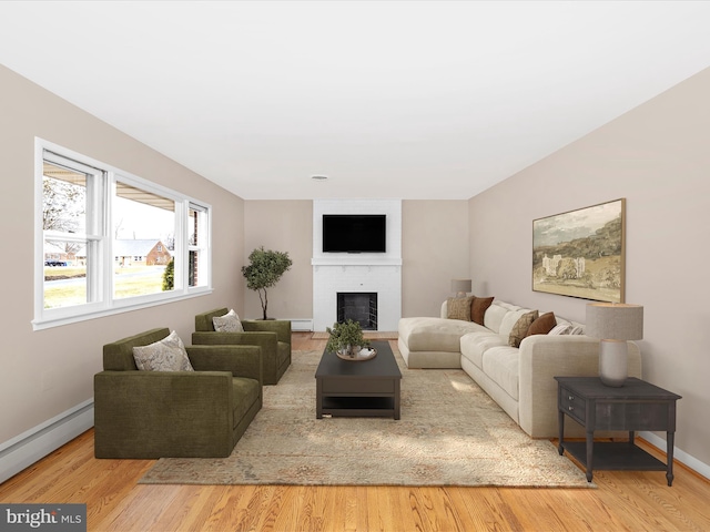 living room featuring a brick fireplace, a baseboard radiator, baseboards, and wood finished floors