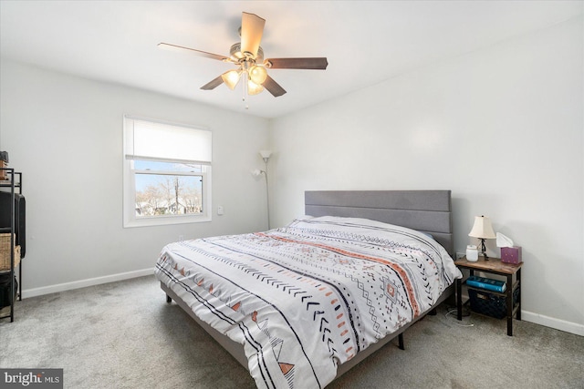 bedroom featuring a ceiling fan, carpet, and baseboards