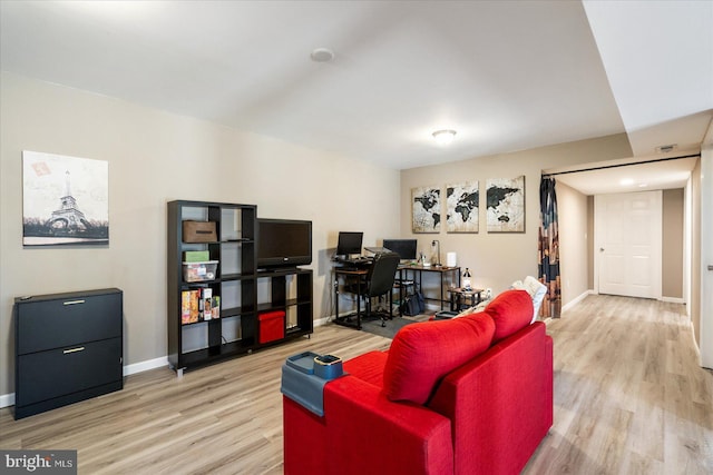 living room with wood finished floors and baseboards