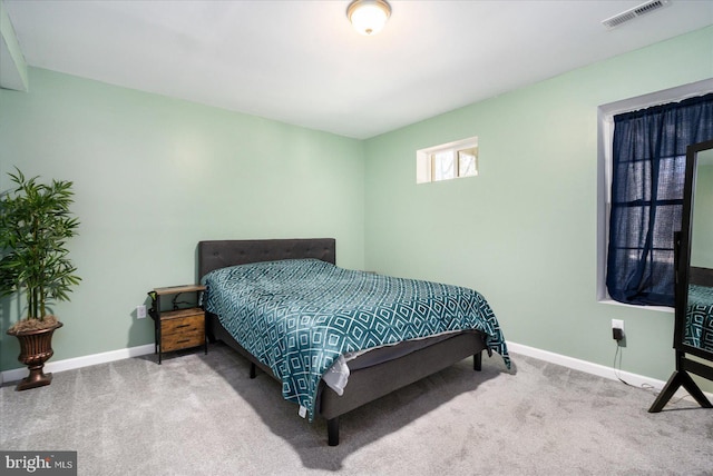 bedroom featuring carpet, visible vents, and baseboards