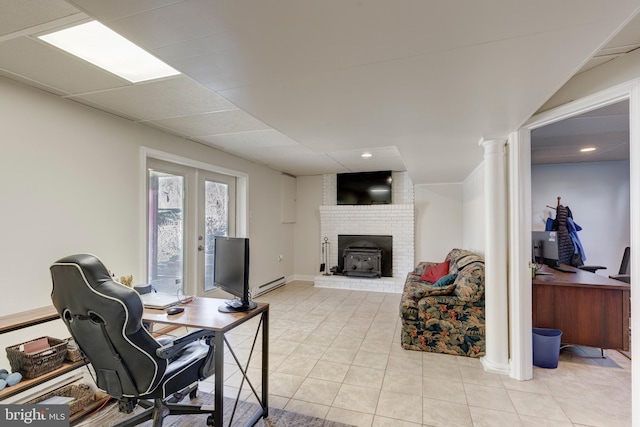 office space featuring light tile patterned flooring, french doors, a paneled ceiling, a baseboard heating unit, and recessed lighting