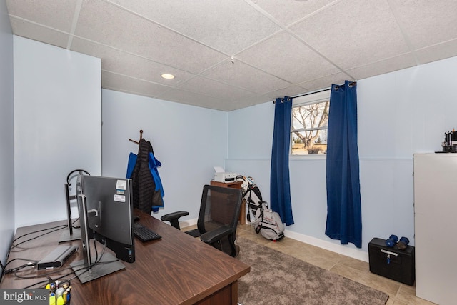 tiled office featuring a drop ceiling