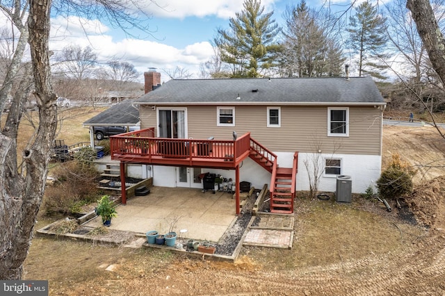 rear view of house with a chimney, stairway, a patio area, a deck, and cooling unit