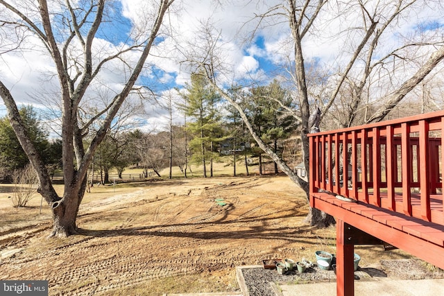 view of yard with a wooden deck