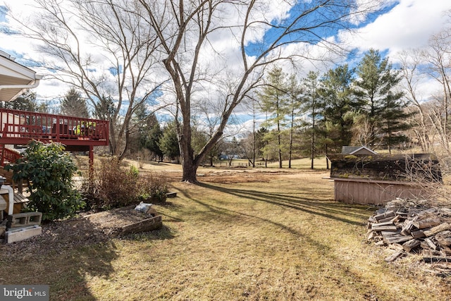 view of yard featuring a wooden deck