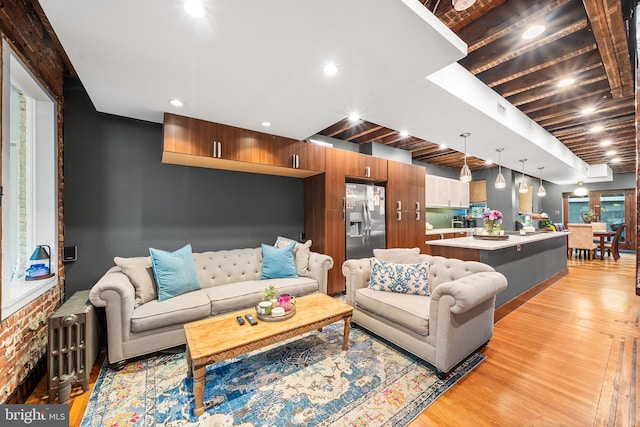 living room featuring light wood-style floors and recessed lighting