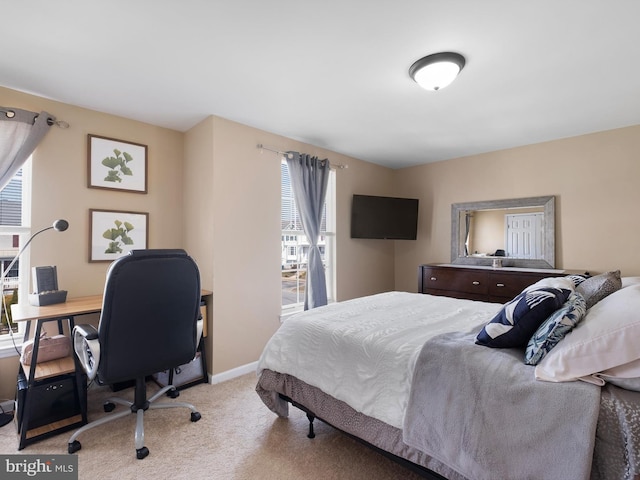 bedroom with carpet and baseboards