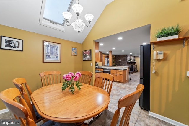 dining area featuring baseboards, vaulted ceiling, a notable chandelier, and recessed lighting