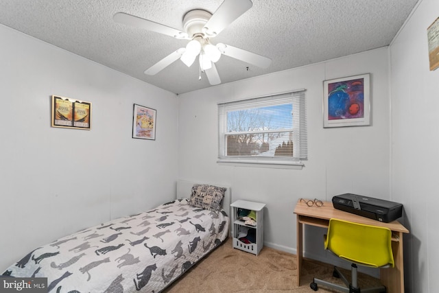 carpeted bedroom featuring a ceiling fan and a textured ceiling