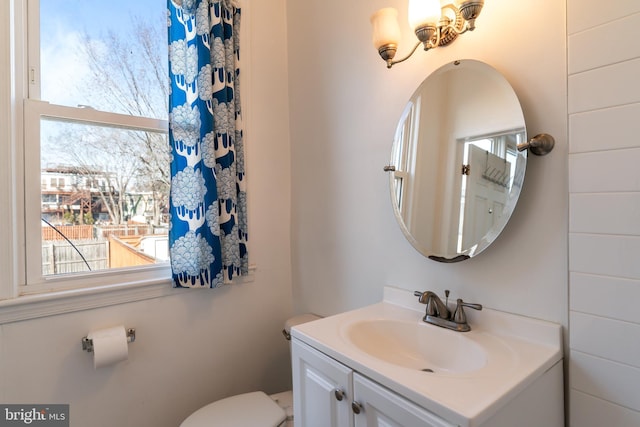 bathroom featuring vanity and toilet