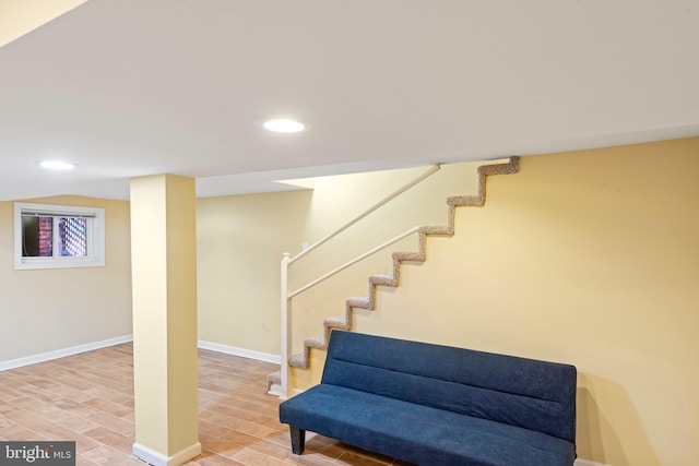 interior space featuring baseboards, wood finished floors, and recessed lighting