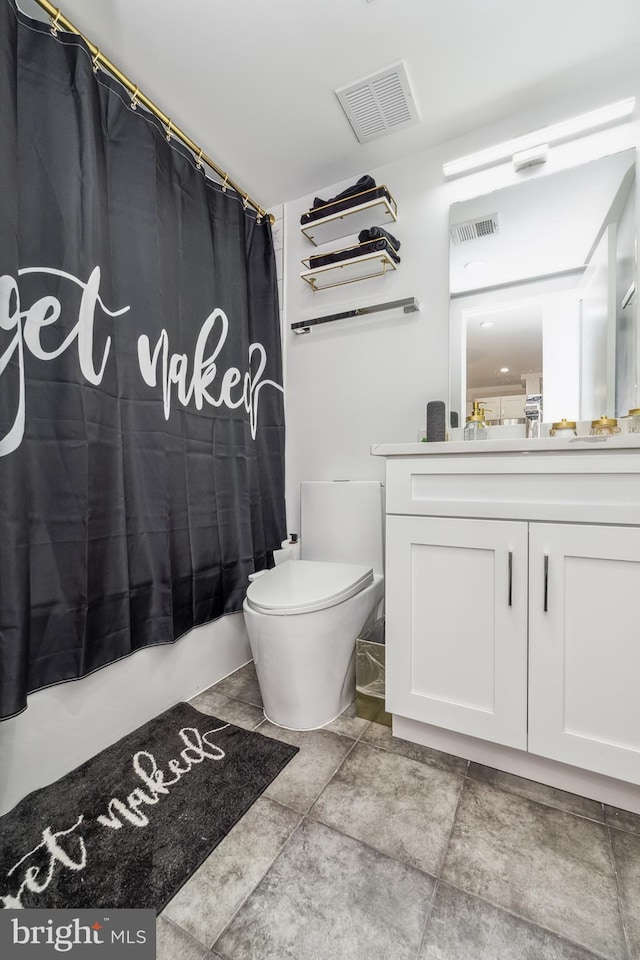 bathroom featuring toilet, shower / bathtub combination with curtain, visible vents, and vanity