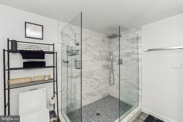 full bathroom with a stall shower and baseboards