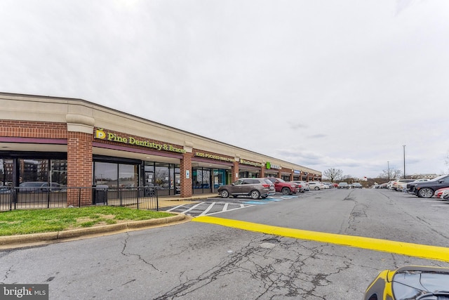 view of property featuring uncovered parking