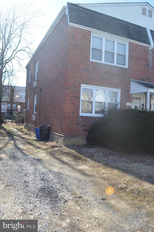 view of side of property with brick siding