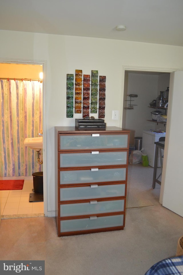 carpeted bedroom with ensuite bathroom