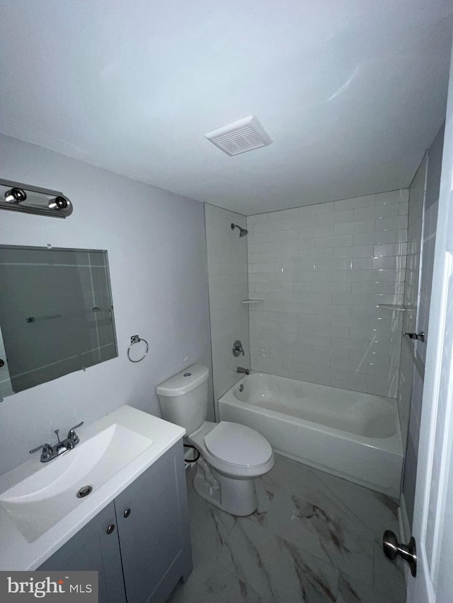 bathroom with toilet, vanity, visible vents, marble finish floor, and tub / shower combination