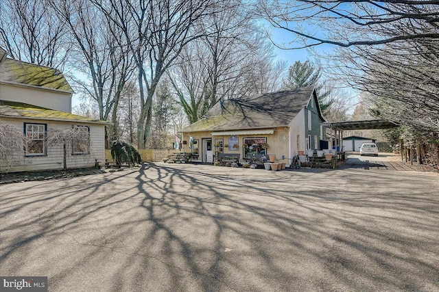 view of home's exterior with an outbuilding