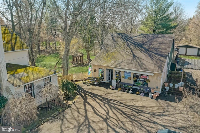 view of front of home featuring a shingled roof