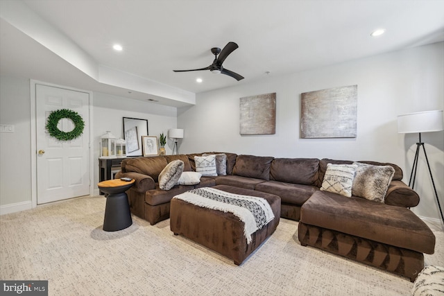 living room featuring carpet, baseboards, a ceiling fan, and recessed lighting