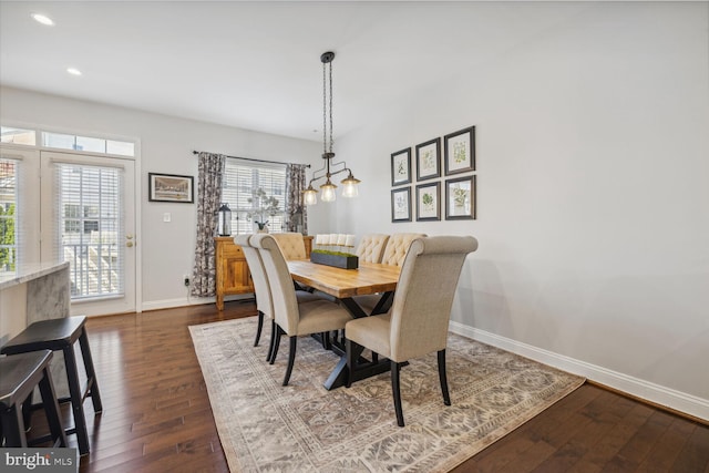 dining space featuring baseboards, dark wood-style flooring, and recessed lighting