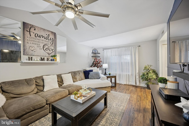 living area featuring lofted ceiling, ceiling fan, and wood finished floors