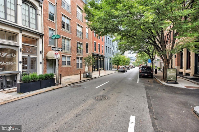 view of street with sidewalks and curbs