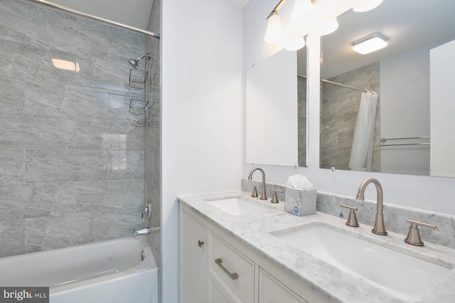 bathroom featuring double vanity, shower / bath combo, and a sink