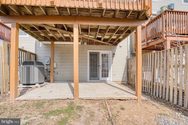 view of patio / terrace featuring cooling unit and fence