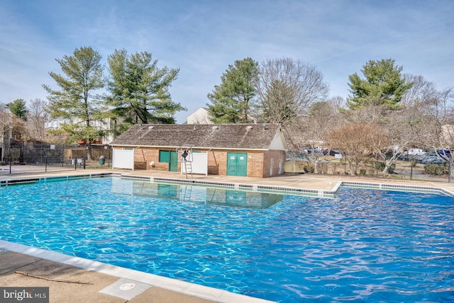 pool featuring a patio and fence