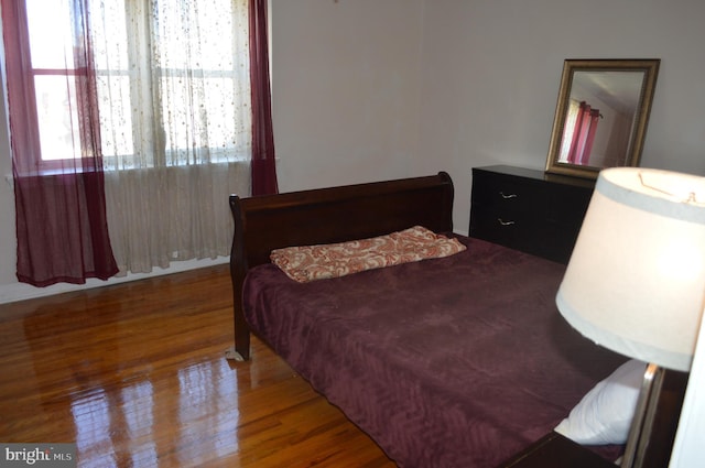 bedroom featuring wood finished floors