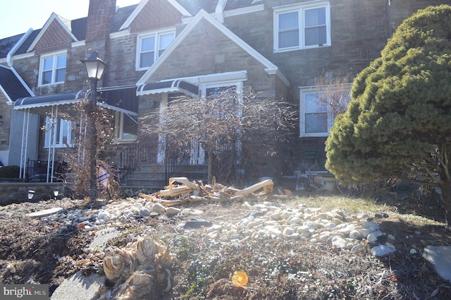 view of front of property with a chimney