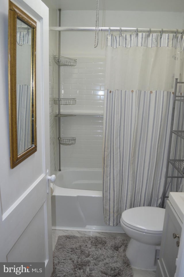 full bath with toilet and shower / bath combo