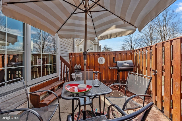 view of patio / terrace with outdoor dining space and area for grilling