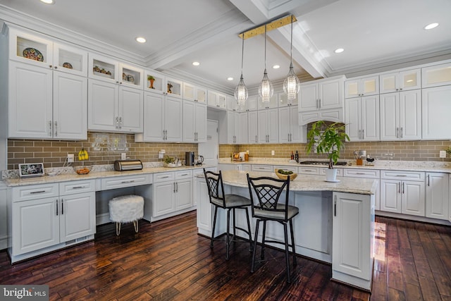 856 N Harrison St, Arlington, VA 22205 - kitchen with white cabinets, beamed ceiling, dark wood-style floors, and a kitchen island