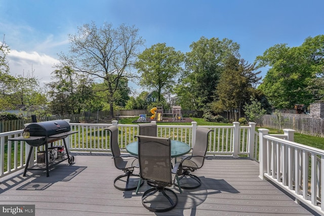 856 N Harrison St, Arlington, VA 22205 - wooden terrace featuring a playground, a lawn, a fenced backyard, and a grill