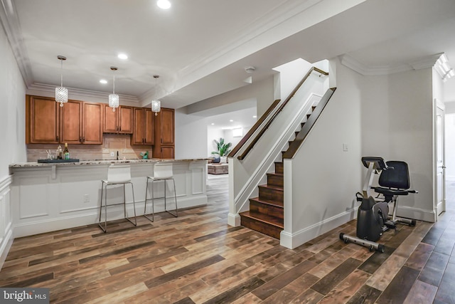 856 N Harrison St, Arlington, VA 22205 - kitchen featuring crown molding, dark wood finished floors, brown cabinetry, recessed lighting, and pendant lighting