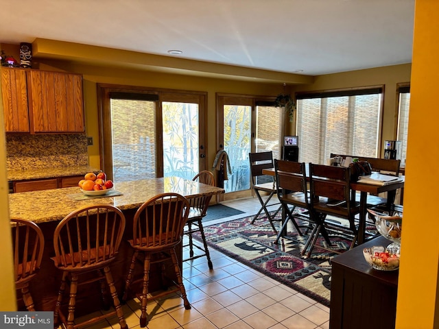 dining area featuring light tile patterned floors