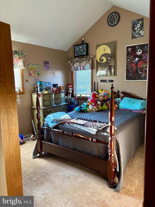 bedroom with lofted ceiling and carpet flooring