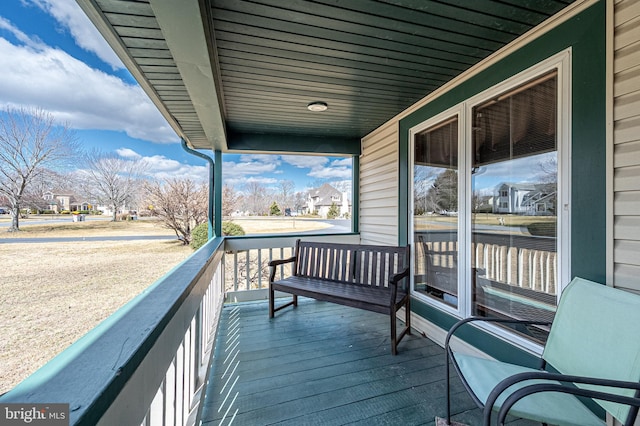 wooden deck featuring covered porch