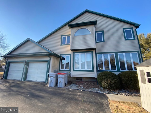 view of front of property with a garage and driveway