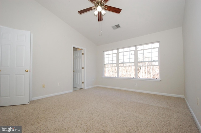 spare room with a ceiling fan, visible vents, high vaulted ceiling, and baseboards