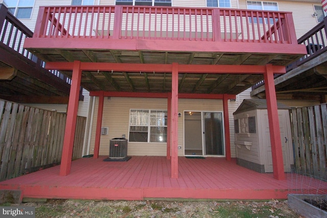 wooden terrace featuring fence and central AC